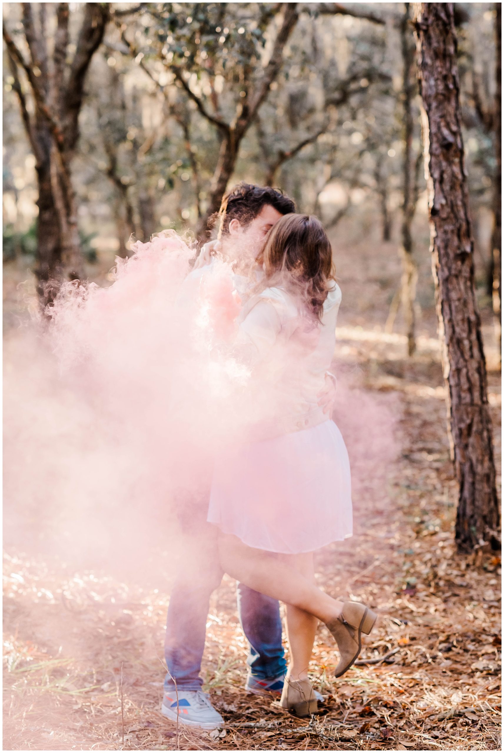 Lake Louisa State Park Gender Reveal Session | Haleigh Nicole Photography | This gender reveal session at Lake Louisa State Park in Clermont, Florida featured pink gender reveal smoke bombs for the couple's baby girl. #genderreveal #smokebombs #genderrevealsmokebombs #lakelouisa #orlandoportraitphotographer #orlandomaternityphotographer #orlandoflorida