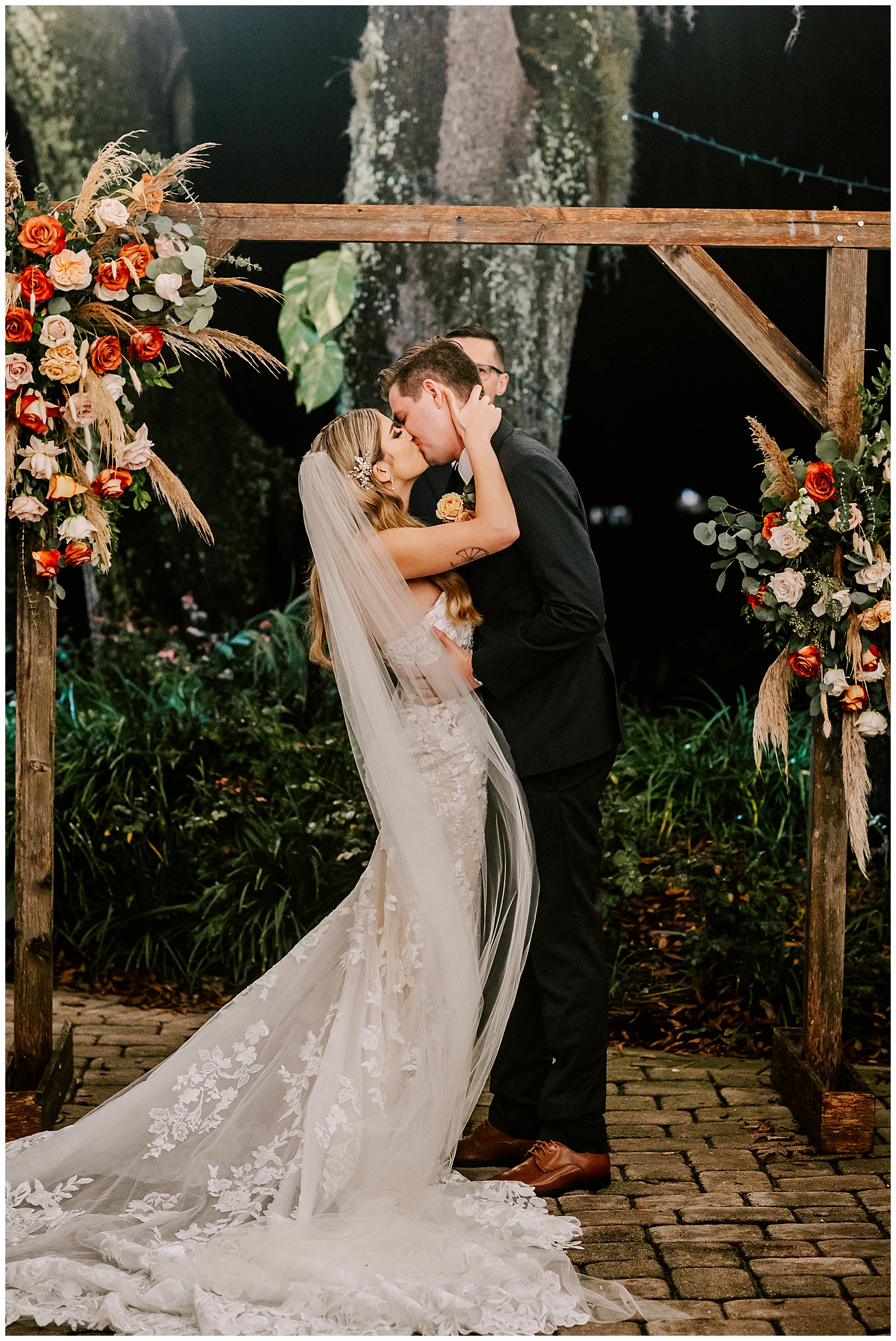 bride and groom share first kiss at Historic Dubsdread Ballroom wedding