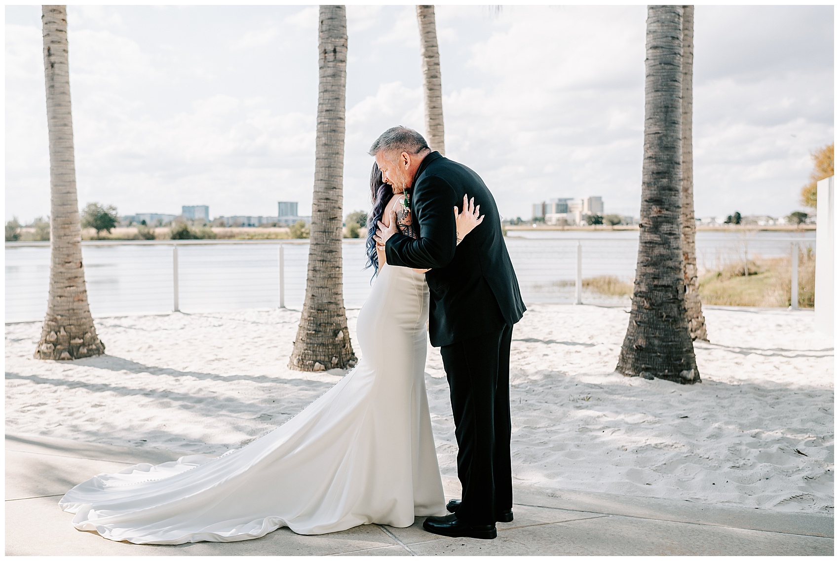 dad and bride embrace during Canvas Lake Nona Wedding