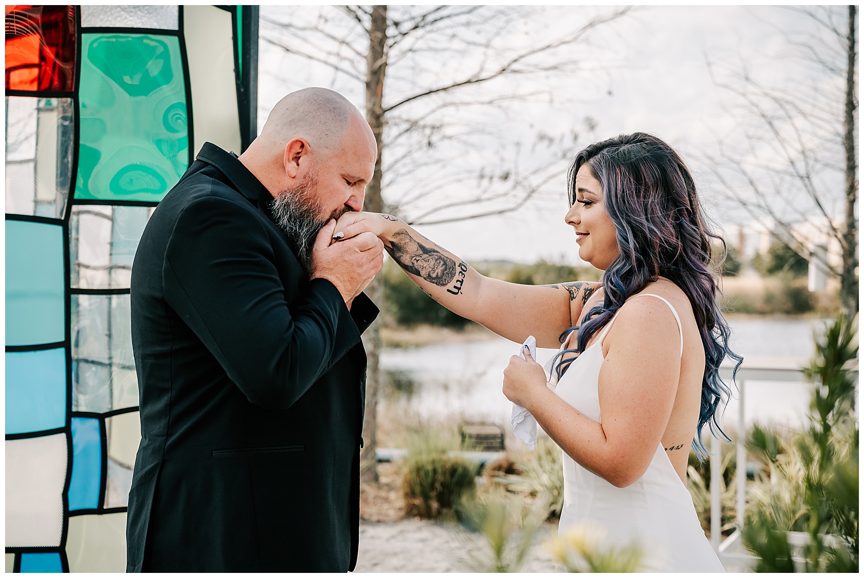 groom kisses brides hand at Canvas Lake Nona Wedding