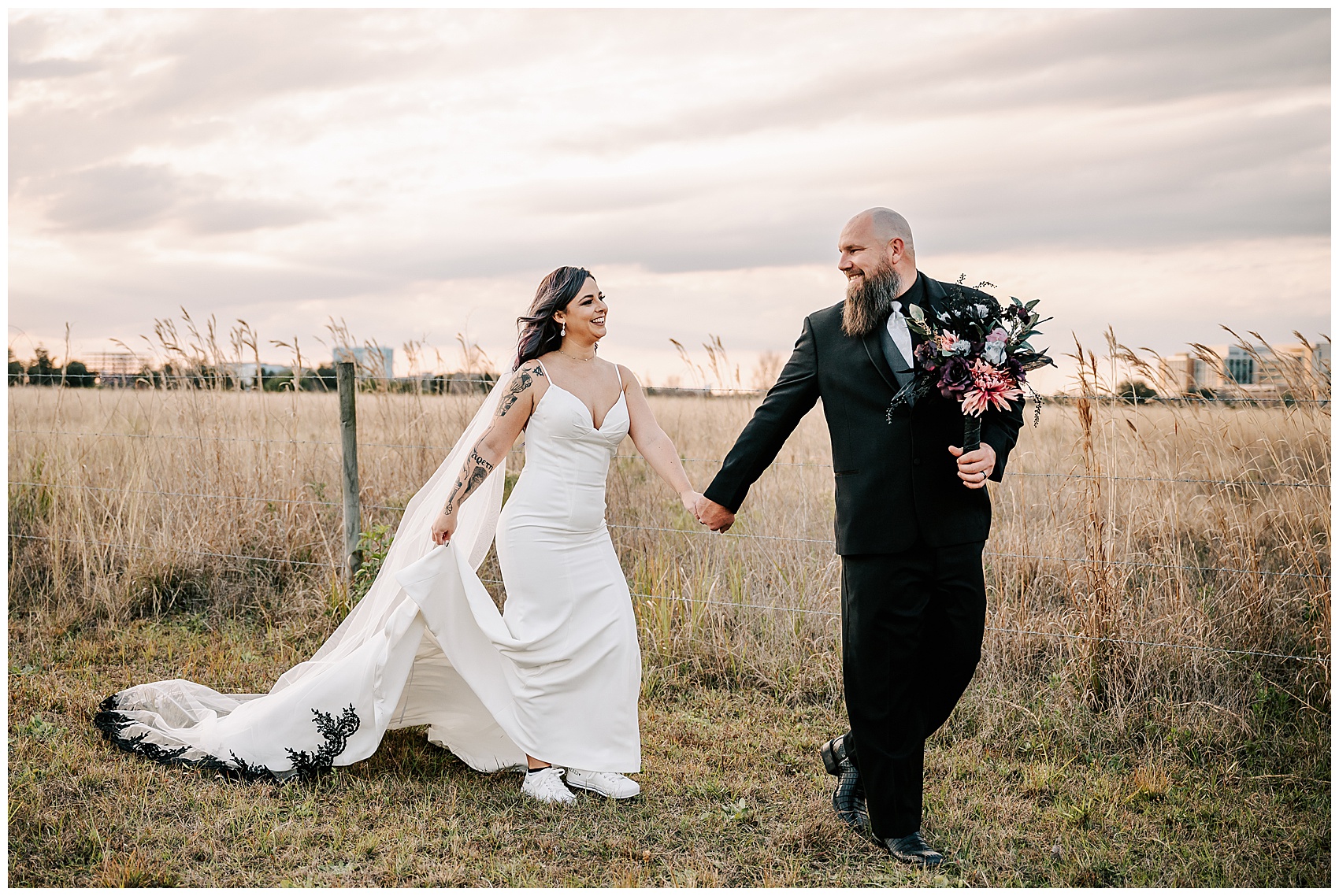 bride and groom walking in a field at Canvas Lake Nona Wedding